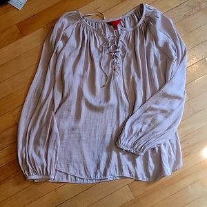 Jennifer Lopez dusty pink blouse with lacing